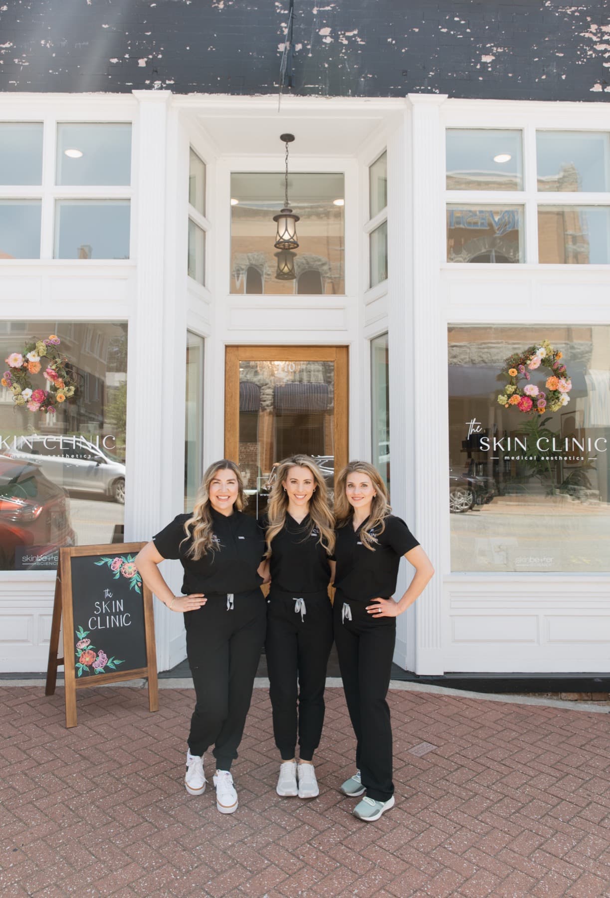 The team outside The Skin Clinic in downtown Siloam Springs